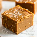 Homemade pumpkin fudge recipe squares with sea salt garnish on parchment paper - creamy fall dessert
