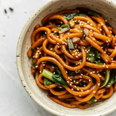 Quick and easy yaki udon stir fry noodles with shiitake mushrooms and bok choy in savory sauce