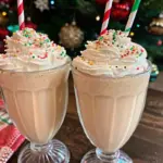 Creamy Christmas Eggnog Milkshake topped with whipped cream and gingersnap crumbs – perfect festive holiday eggnog shake recipe.