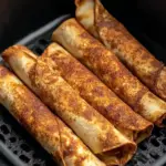 A delicious plate of Easy Air Fryer Apple Pie Taquitos