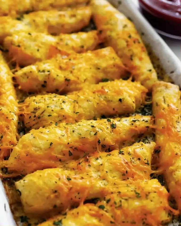 A delicious plate of Cheesy Cheddar Garlic Breadsticks