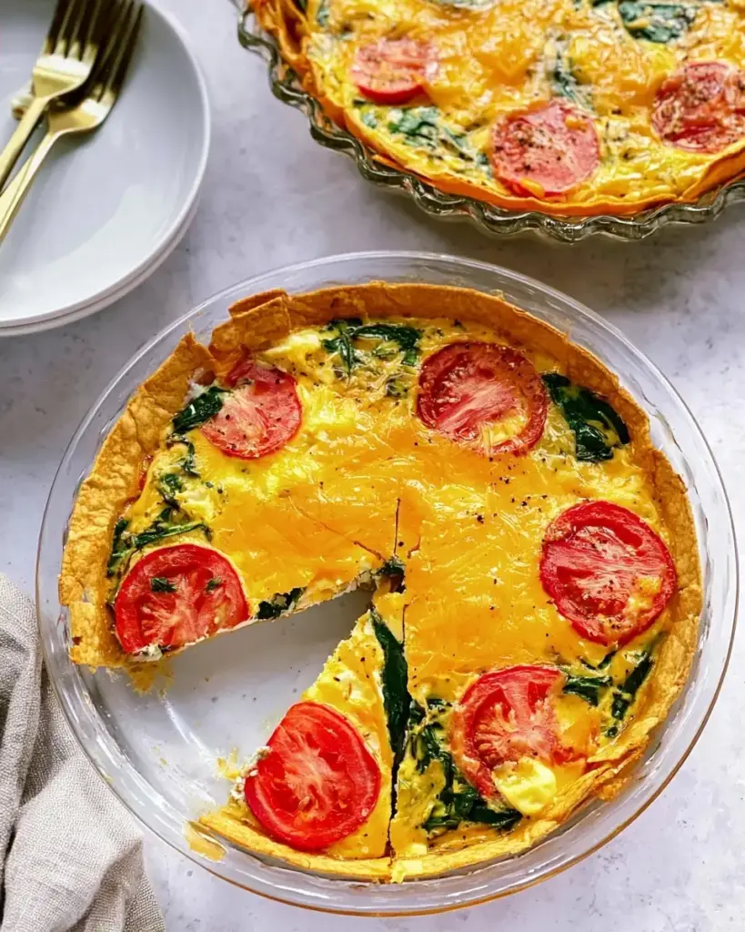 A delicious plate of Spinach Tomato Tortilla Quiche