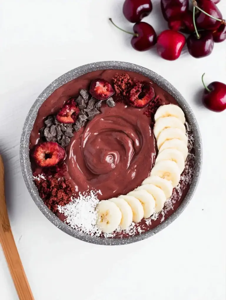 A delicious plate of Chocolate Cherry Smoothie Bowl